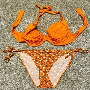 Tommy Bahama bikini, orange top and orange print bottom.